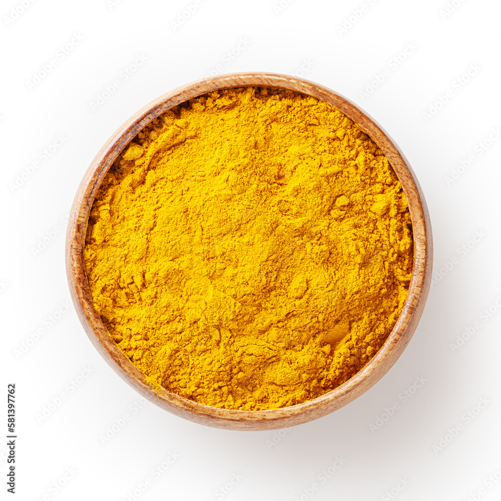 Dry turmeric (curcuma) powder in wooden bowl isolated on white background with clpping path