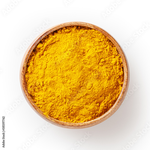 Obraz na płótnie Dry turmeric (curcuma) powder in wooden bowl isolated on white background with clpping path w salonie