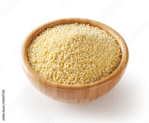 Uncooked dried cous cous in wooden bowl isolated on white background with clipping path