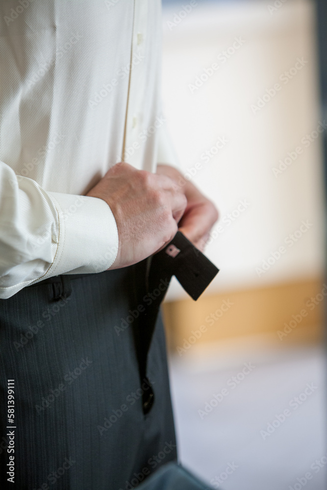 Detailed shot of businessman getting ready. High quality photo
