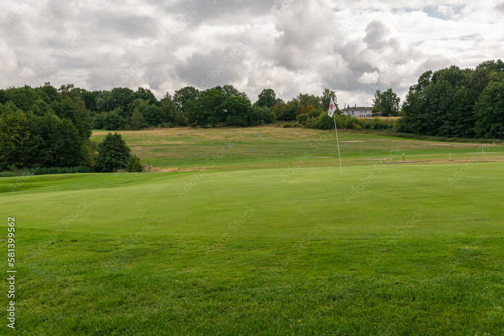 Golf course, golf field on a cloudy summer day. Beautiful nature, green grass. Dynamic sky. Golf course, golf field on a cloudy summer day. Beautiful nature, green grass. Dynamic sky.