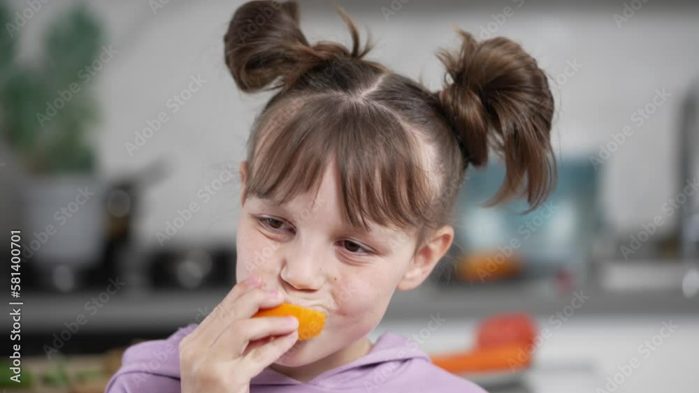 Portrait of a Little Girl Eating an Orange Slice Portrait of a Little Girl Eating an Orange Slice