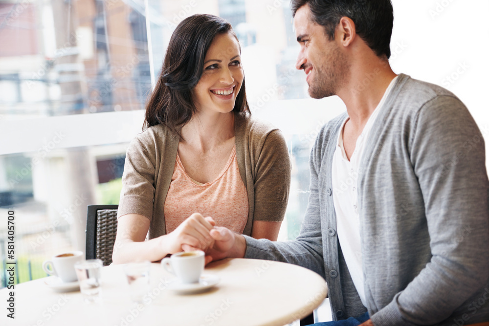 Reminiscing over some coffee. a young couple grabbing a cup of coffee together. Reminiscing over some coffee. a young couple grabbing a cup of coffee together.