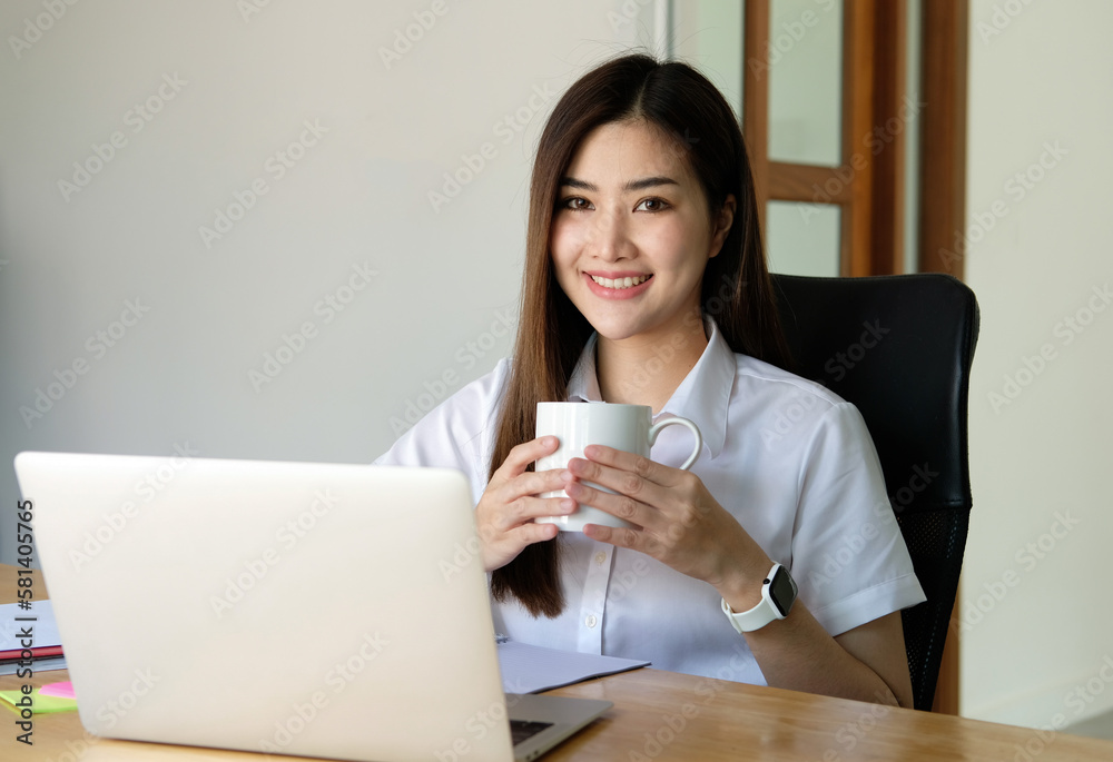 Beautiful young woman working on laptop computer while sitting in cafe. Freelancer business woman thinking about new ideas during work on laptop computer, drink coffee, enjoy of coffee smell. Beautiful young woman working on laptop computer while sitting in cafe. Freelancer business woman thinking about new ideas during work on laptop computer, drink coffee, enjoy of coffee smell.