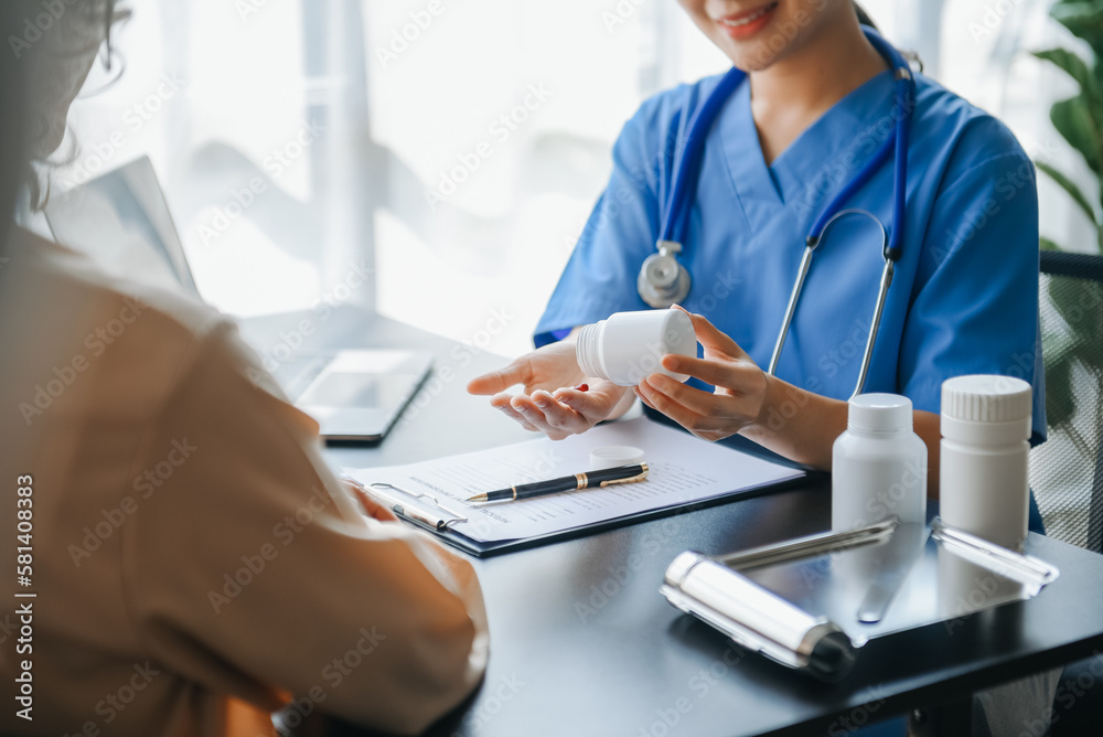 Woman doctor consulting with patient discussing something and Presenting results on report, Medicine and health care concept.. Woman doctor consulting with patient discussing something and Presenting results on report, Medicine and health care concept..