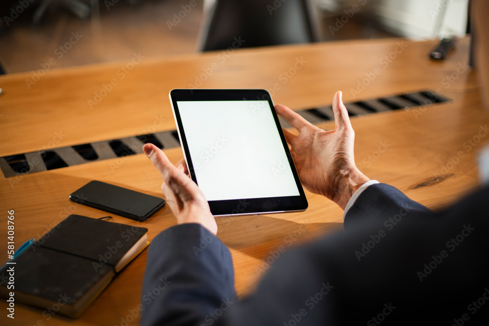 Close up of man using digital tablet..