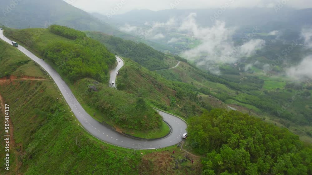 Flying With the Clouds On the road view above the mountains in a high altitude Da Nang Hill, Vietnam 4K Video Flying With the Clouds On the road view above the mountains in a high altitude Da Nang Hill, Vietnam 4K Video