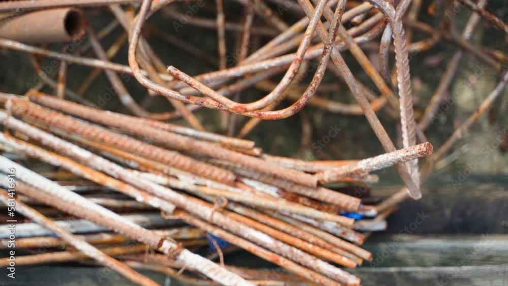 Rusty scrap metal close-up. Metal bars of different types in corrosion on the street. Smooth camera movement Rusty scrap metal close-up. Metal bars of different types in corrosion on the street. Smooth camera movement