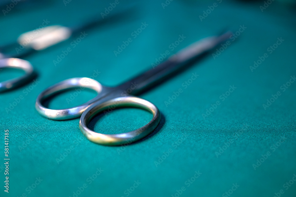 surgical metal equipment preparation operating surgery including cotton scissors tweezers tissue suture materials and knife. medical instrumental set preparation for using in operating surgery room surgical metal equipment preparation operating surgery including cotton scissors tweezers tissue suture materials and knife. medical instrumental set preparation for using in operating surgery room