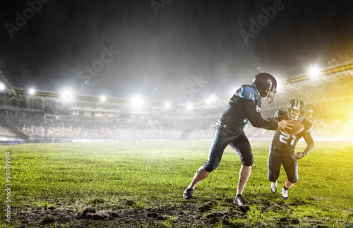 Businessman acting as american football players © Sergey Nivens