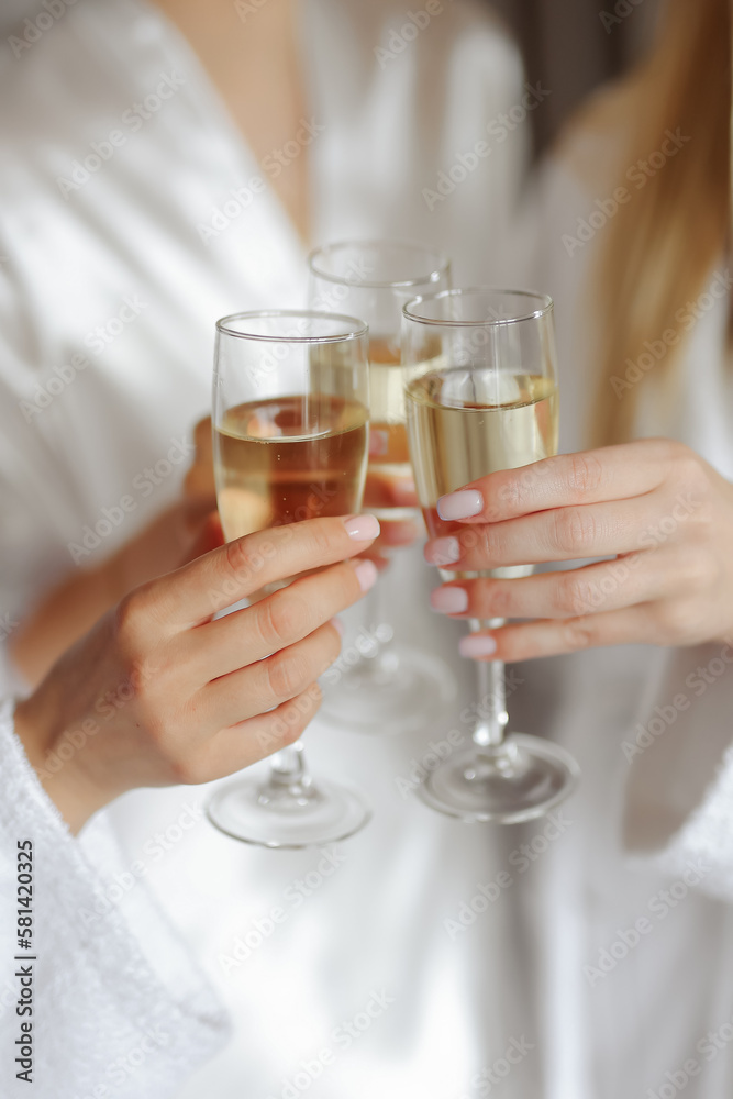 luxury elegant women at celebration drinking champagne in restaurant terrace
