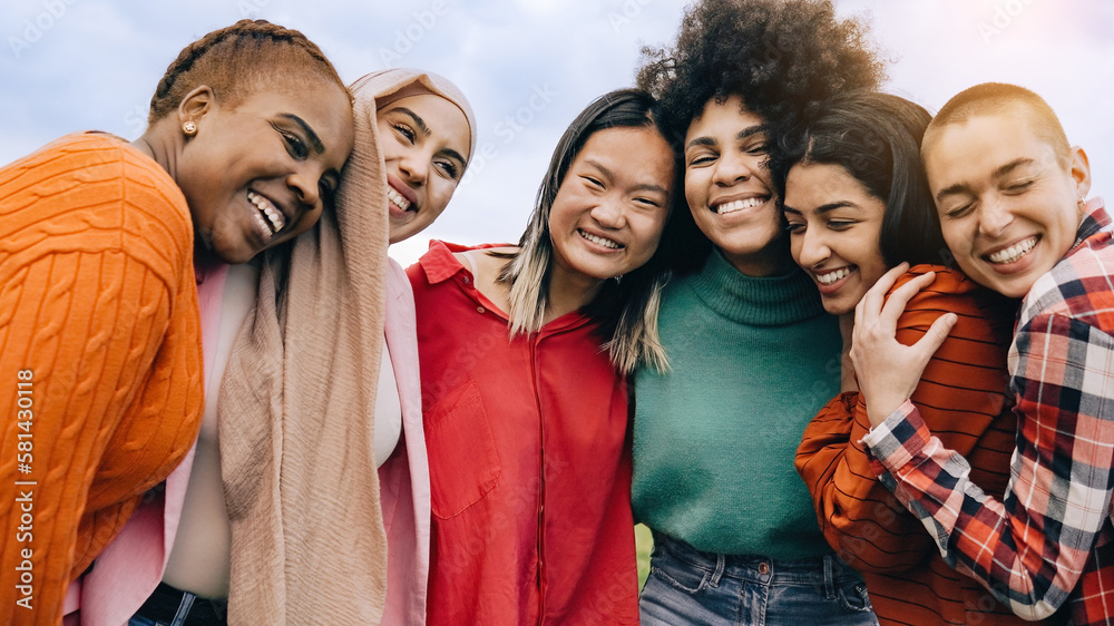 Fototapeta premium Multiethnic group of women having fun together outdoors during summer time - Youth culture lifestyle - Focus on Asian girl face