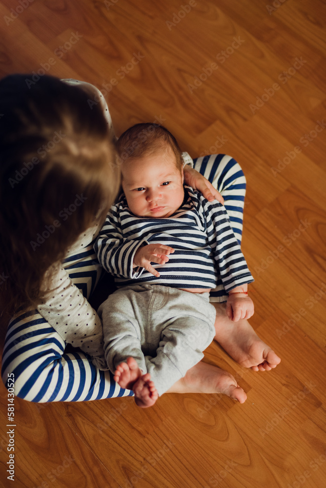 baby child sitting on the floor baby child sitting on the floor