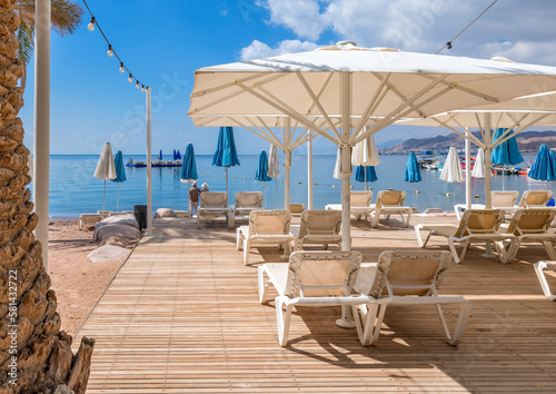 Morning on sandy beach of the Red Sea in Eilat - famous tourist resort and re...