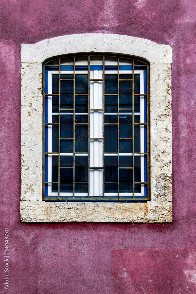 Colorful portuguese facade with white window