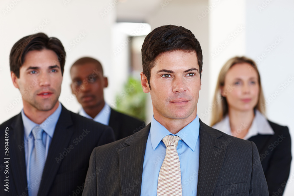 Looking to the future. Diverse group of business professionals standing indoors. Looking to the future. Diverse group of business professionals standing indoors.