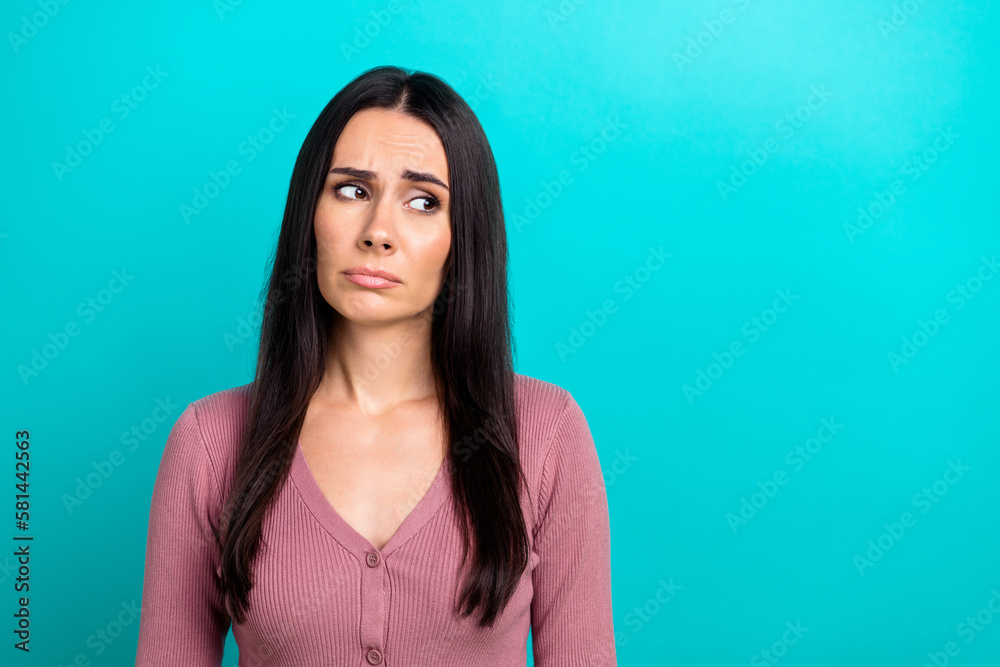 Photo of unsatisfied gloomy person look empty space sad sullen face isolated on turquoise color background - obrazy, fototapety, plakaty 