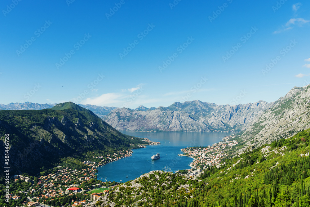 Top view of the Bay of Kotor in which there is a huge tourist liner. Postcard view