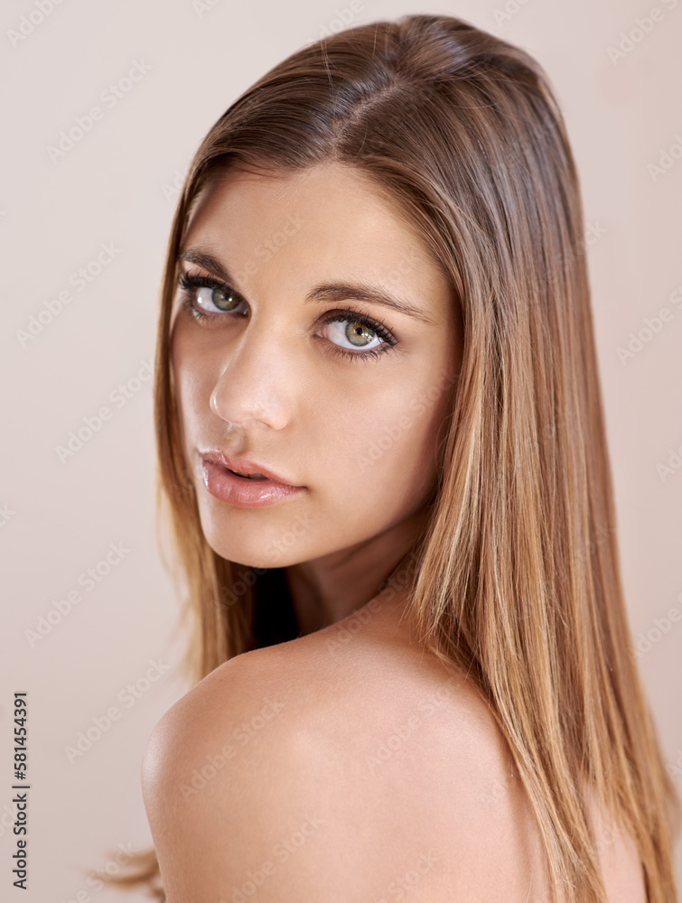 Fototapeta premium Beguiling beauty. Studio portrait of an attractive model gazing at the camera.