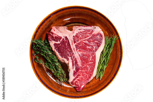 Raw porterhouse beef meat Steak with herbs on a plate. Isolated, transparent background.
