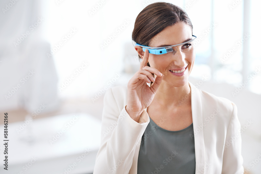 Visions of the future. Portrait of a young businesswoman wearing smart glasses at work. Visions of the future. Portrait of a young businesswoman wearing smart glasses at work.