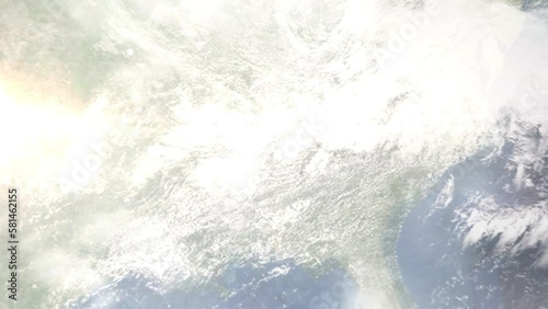 Earth zoom in from outer space to city. Zooming on Decatur, Alabama, USA. The animation continues by zoom out through clouds and atmosphere into space. Images from NASA photo