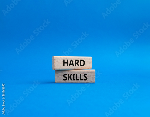Hard skills symbol. Wooden blocks with words Hard skills. Beautiful blue background. Business and Hard skills concept. Copy space.