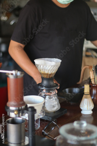 barista brewing coffee, pour over coffee