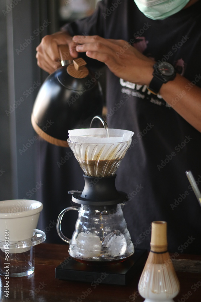 barista brewing coffee, pour over coffee barista brewing coffee, pour over coffee