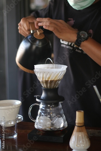 barista brewing coffee, pour over coffee