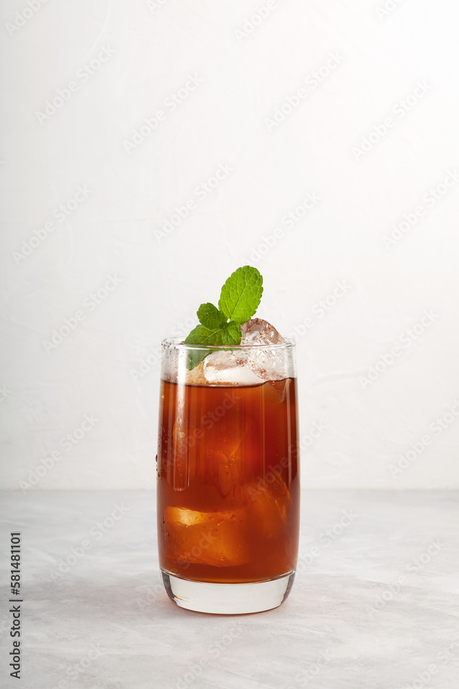 Iced Tamarind drink or Tamarind ice tea in tall glass. Refreshing summer mexican drink with natural ingredients. Agua de Tamarindo Iced Tamarind drink or Tamarind ice tea in tall glass. Refreshing summer mexican drink with natural ingredients. Agua de Tamarindo