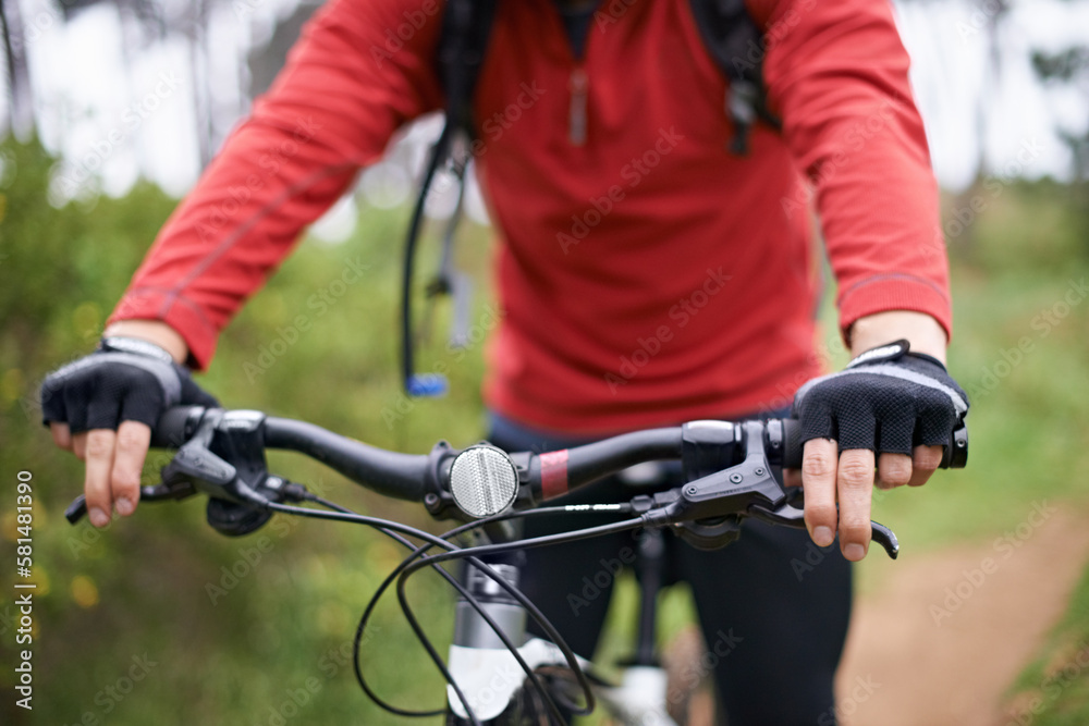 Always prepared to brake. Closeup shot of a cyclist and the front of his mountain bike. Always prepared to brake. Closeup shot of a cyclist and the front of his mountain bike.