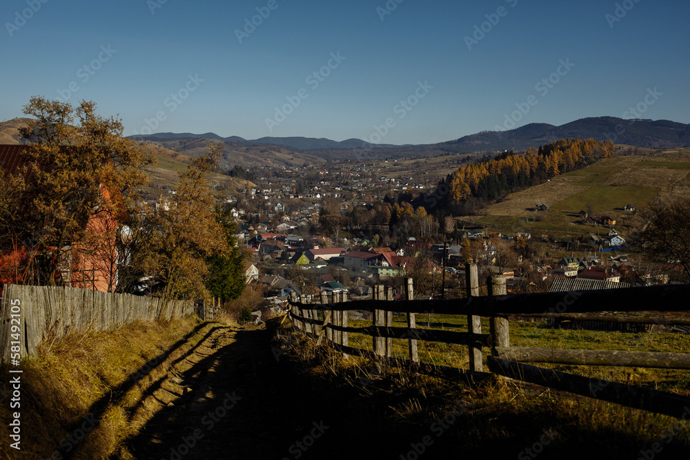Wooden fences on the background of autumn mountains