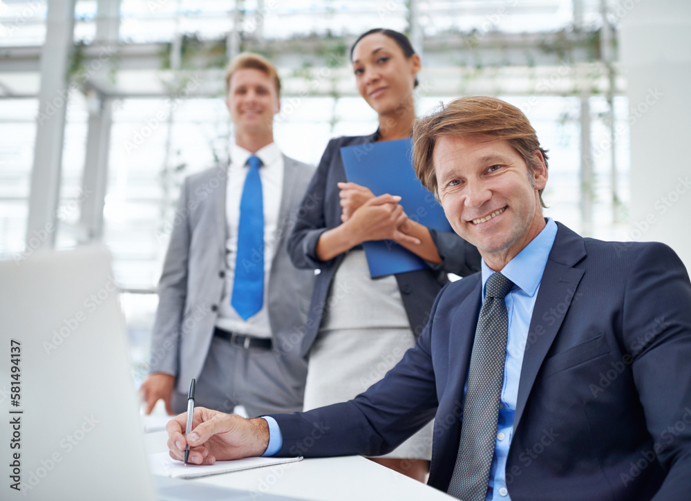 The team has excelled under his leadership. Portrait of a team of business professionals. The team has excelled under his leadership. Portrait of a team of business professionals.