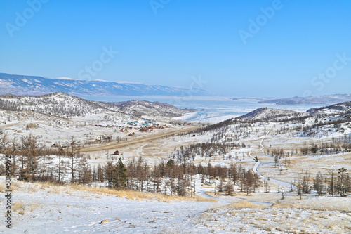 Scenery of Frozen Lake Baikal and Small Colorful Village in Russia