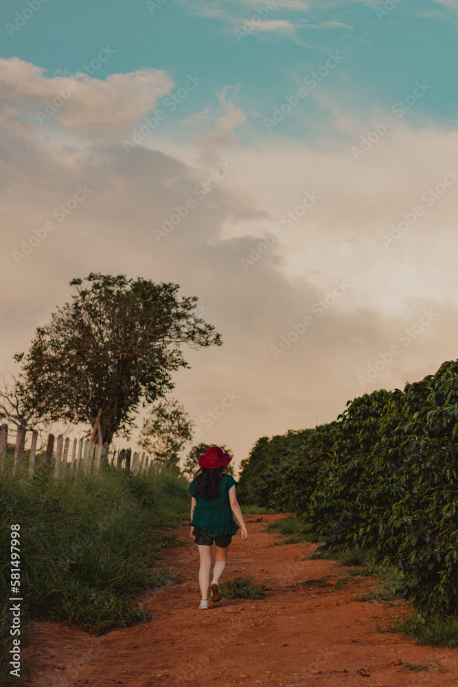 young woman walking at dusk