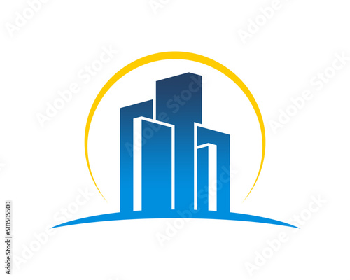 Real estate building with sunrise behind vector logo