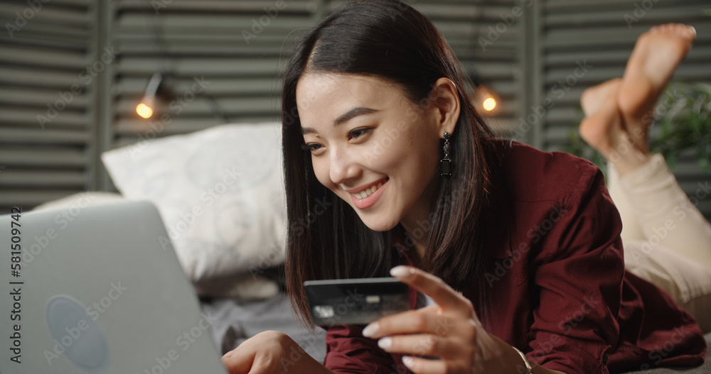 Happiness Entrepreneur beautiful business asian young woman wear casual use laptop for shopping online enjoy with social media and laptop at home.Small Business Startup.online banking