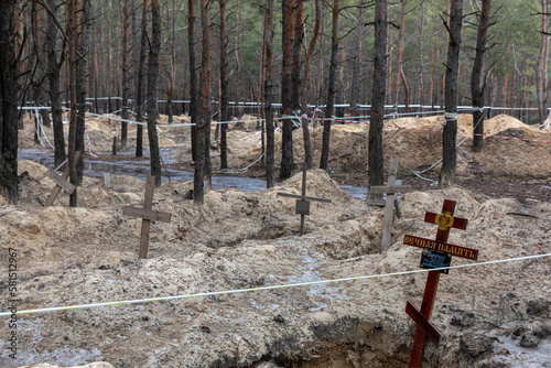 Mass grave site near Izium for civilian victims of war photo