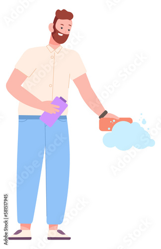 Man cleaning surface with detergent foam and sponge