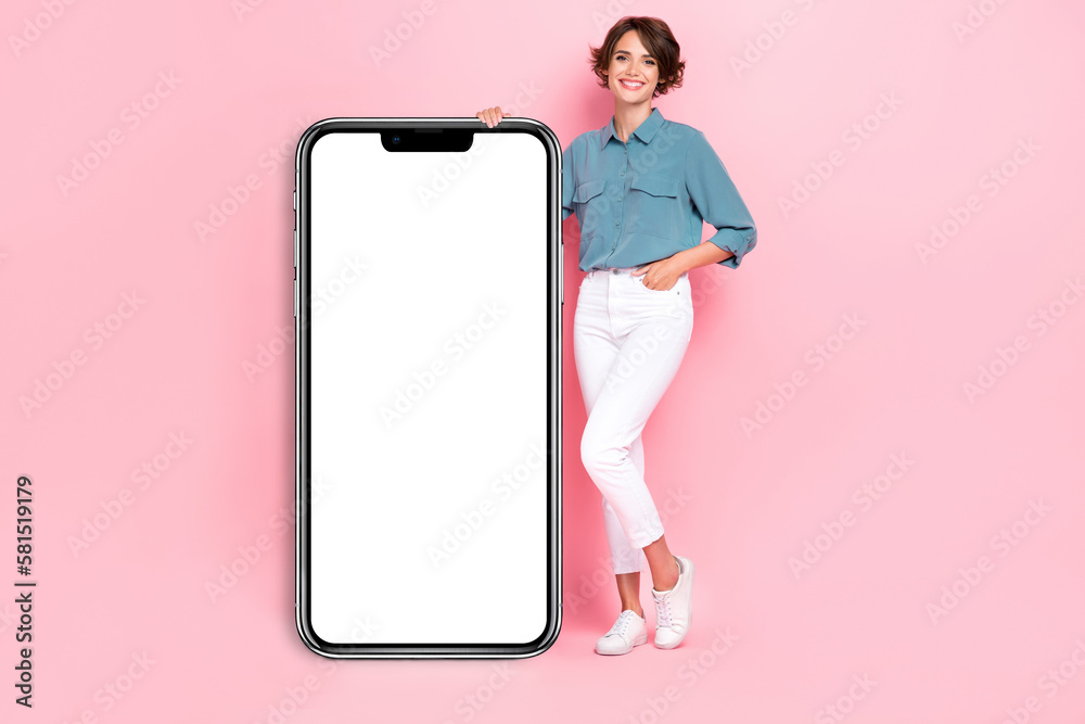 Photo of cute positive lady stylish clothes hand hold big mirror placard banner demonstrate empty space isolated on pink color background Photo of cute positive lady stylish clothes hand hold big mirror placard banner demonstrate empty space isolated on pink color background