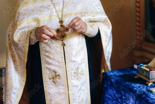 Catholic priest holding praying hands