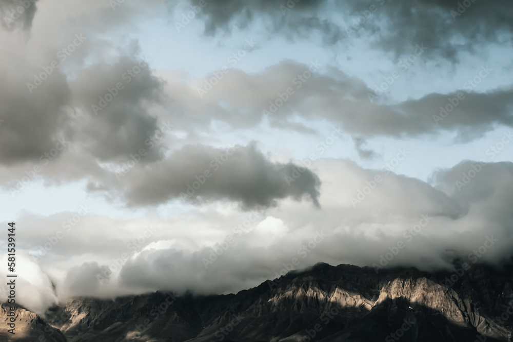Afghanistan landscape, a mountain with a fluffy clouds in blue sky Afghanistan landscape, a mountain with a fluffy clouds in blue sky