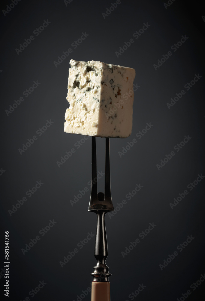 Blue cheese on a fork. Blue cheese on a fork.