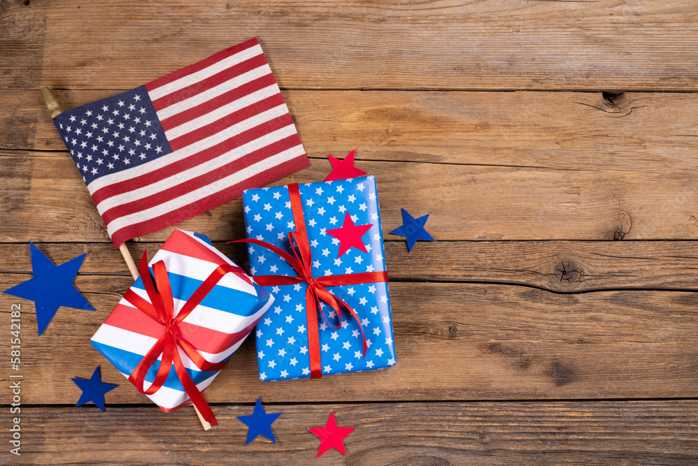 Fototapeta premium USA independence day, celebration, patriotism and holidays concept - close-up with candy flag and stars at 4th of july party from above on wooden background