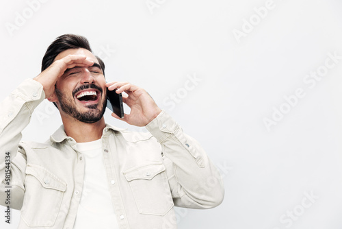 Closeup portrait man talking on the phone smile with teeth happiness and laughter on white isolated background, fashion style clothes, copy space, space for text