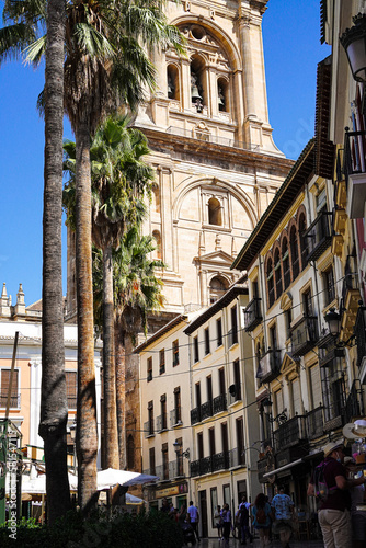 View of the city square with the clock tower of Granada Cathedral in the background, Granada, Andalusia, Spain © honey
