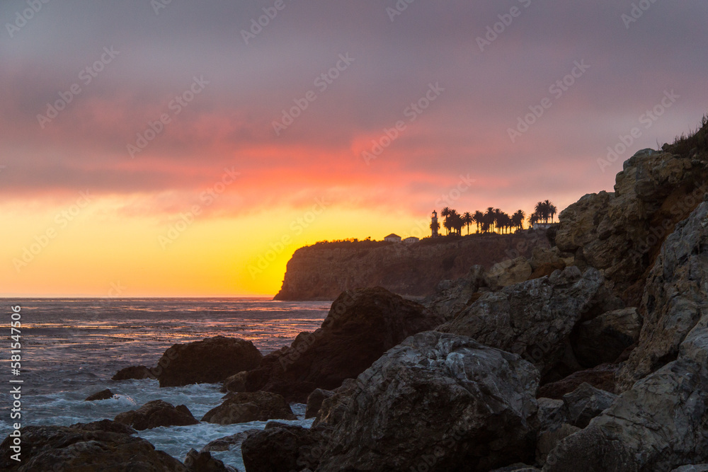 Sunsetting behind the lighthouse in palos verdes in Los Angeles
