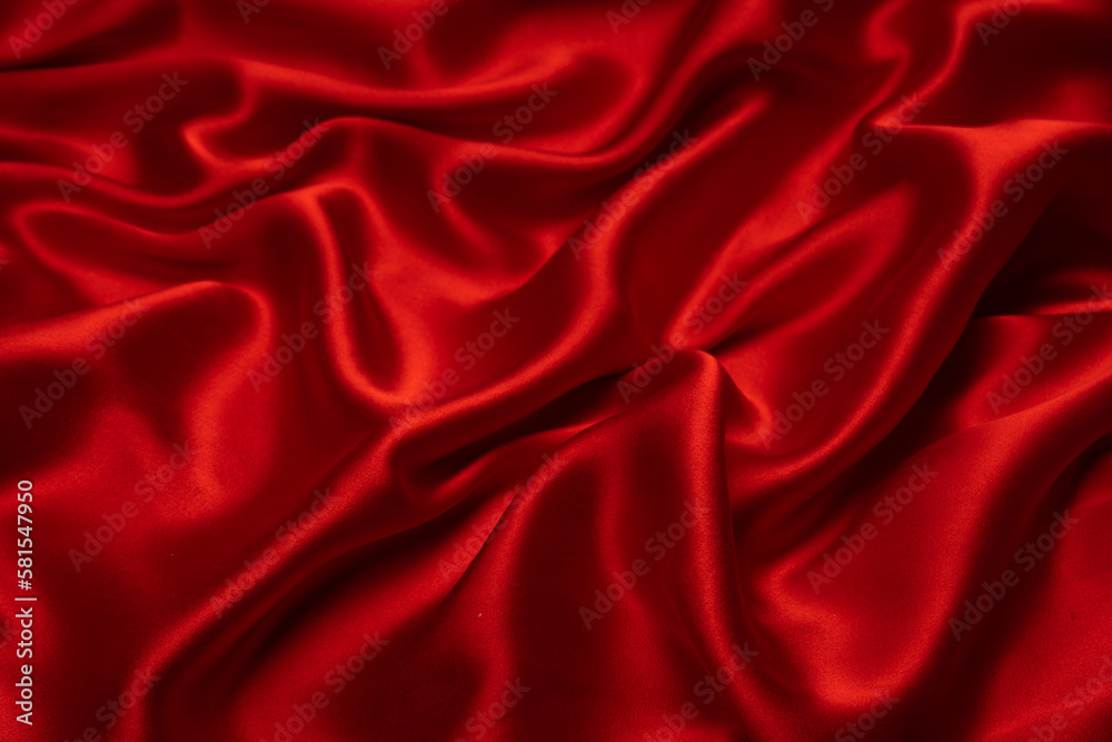 Red silk or satin luxury fabric texture can use as abstract background.