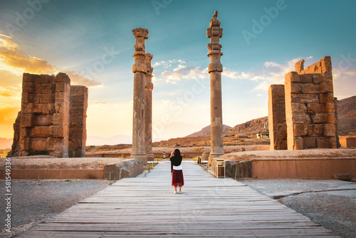 Tourist walk explore sightseeing famous destination - Persepolis ancient - persian city in south Iran. Famous travel destination in middle east
